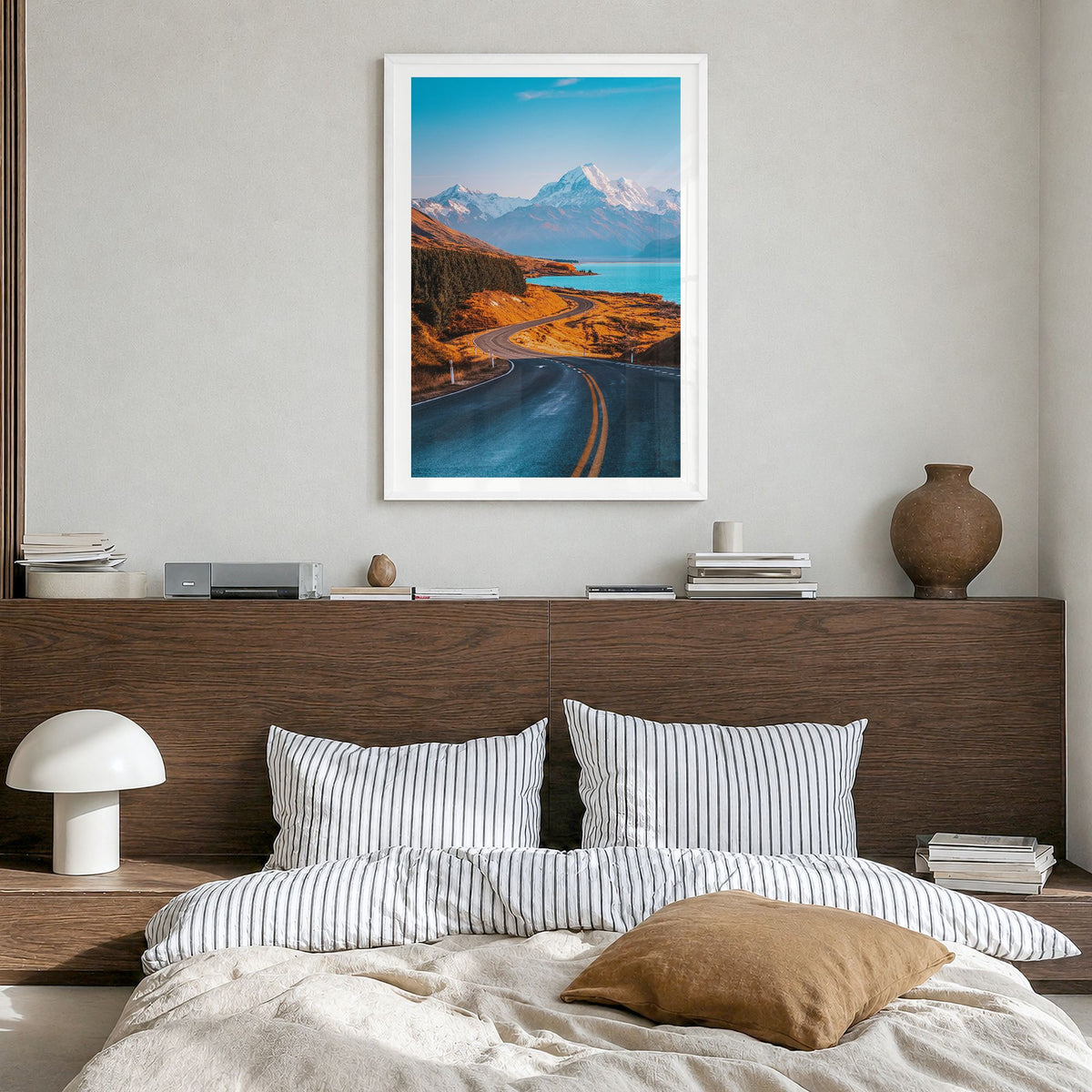 Mount Cook Photo Poster in a white wood frame, hanging in a bedroom, white border