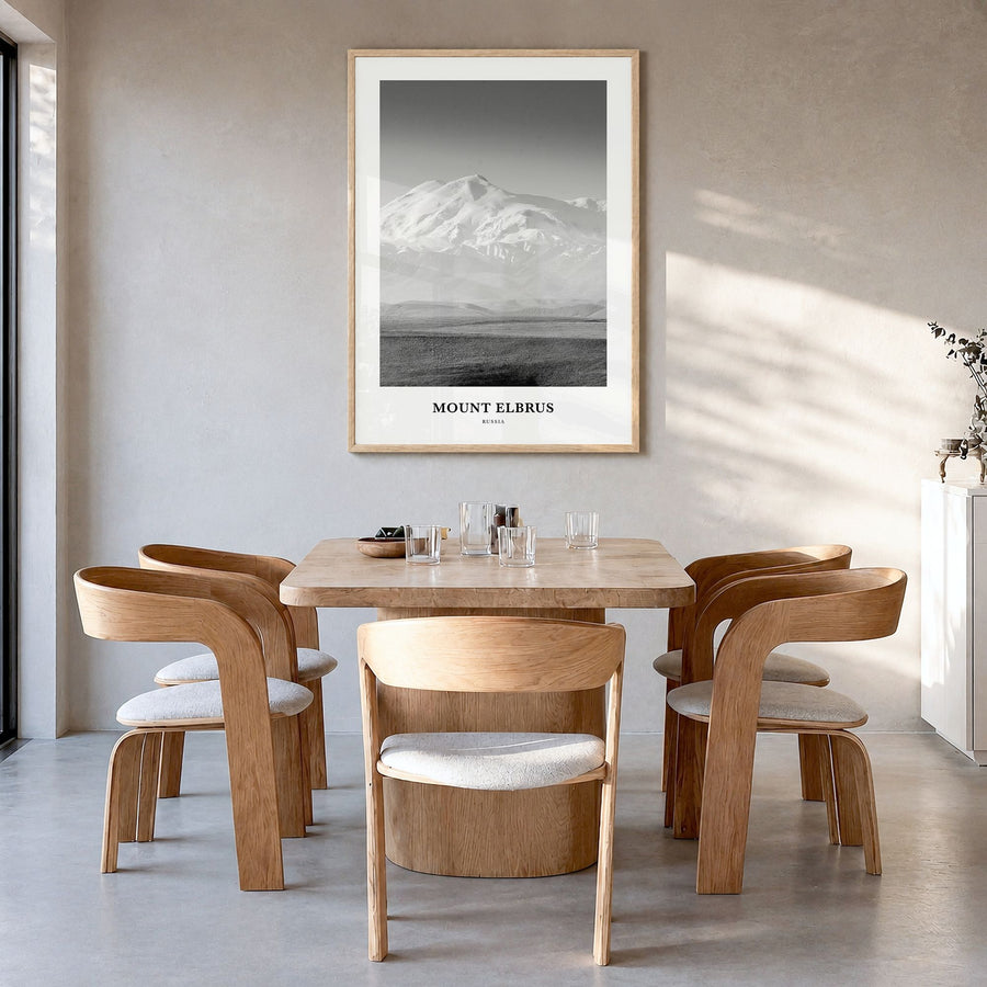 Mount Elbrus Classic Poster in a natural wood frame, hanging in a dining room