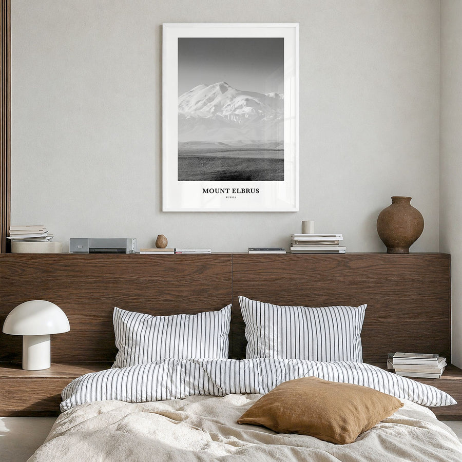 Mount Elbrus Classic Poster in a white wood frame, hanging in a bedroom
