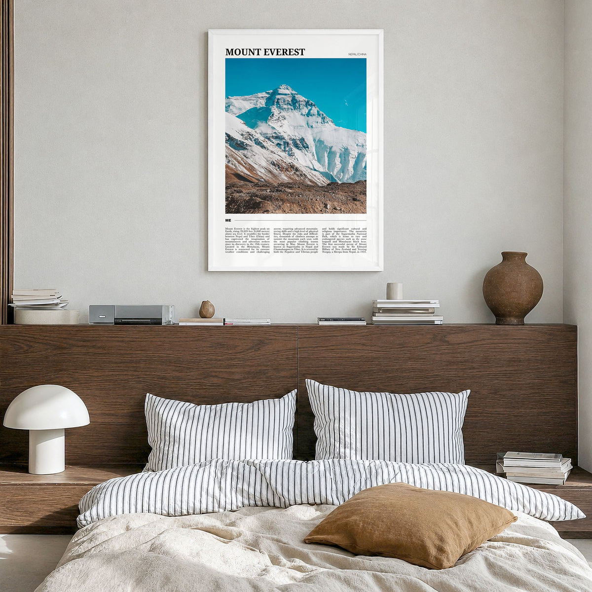 Mount Everest Travel Poster in a white wood frame, hanging in a bedroom