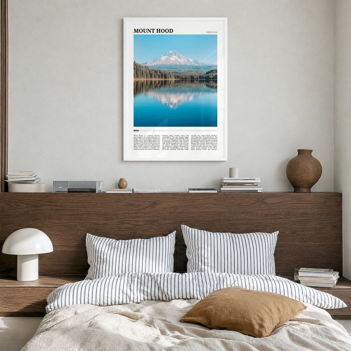 Mount Hood Travel Poster in a white wood frame, hanging in a bedroom