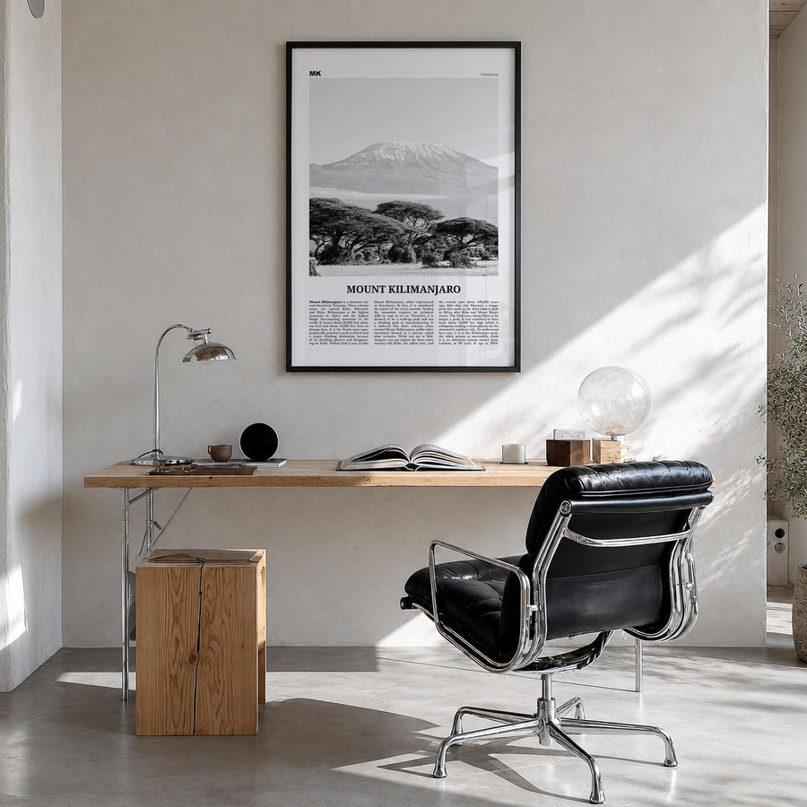 Mount Kilimanjaro black & white newspaper poster of Tanzania – vertical wall art in black wood frame, hanging on wall
