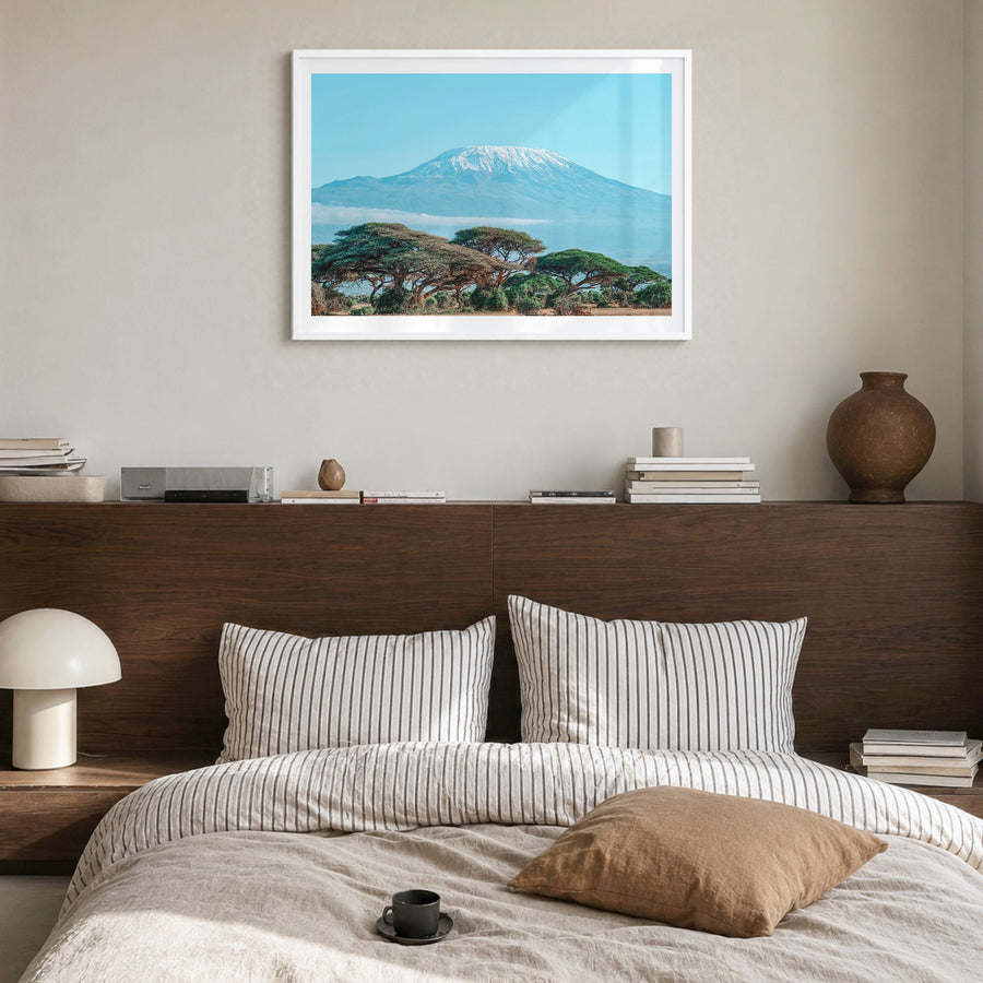 Mount Kilimanjaro Photo Poster in a white wood frame, hanging in a bedroom, white border