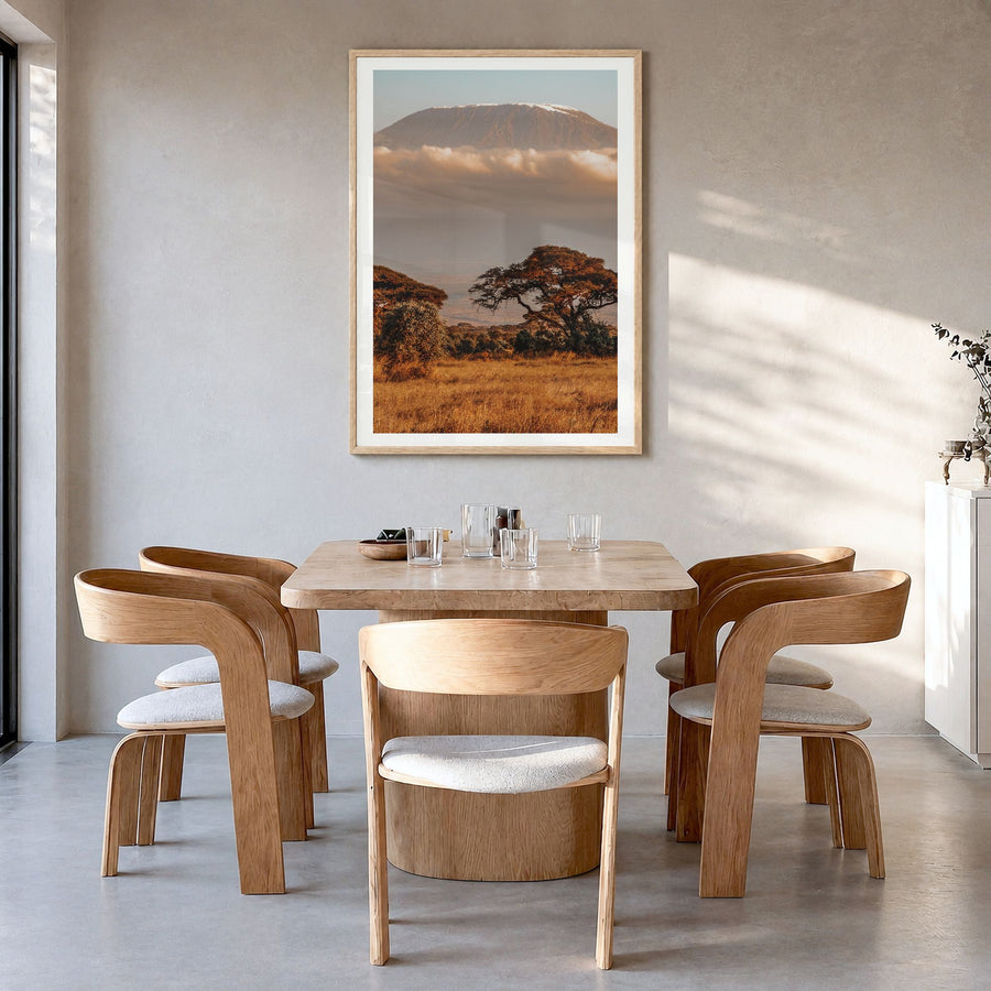 Mount Kilimanjaro Photo No 1 Poster in a natural wood frame, hanging in a dining room, white border