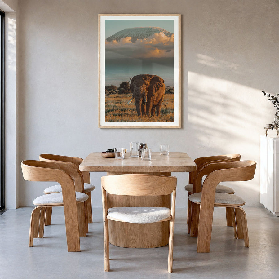 Mount Kilimanjaro Photo No 2 Poster in a natural wood frame, hanging in a dining room, white border