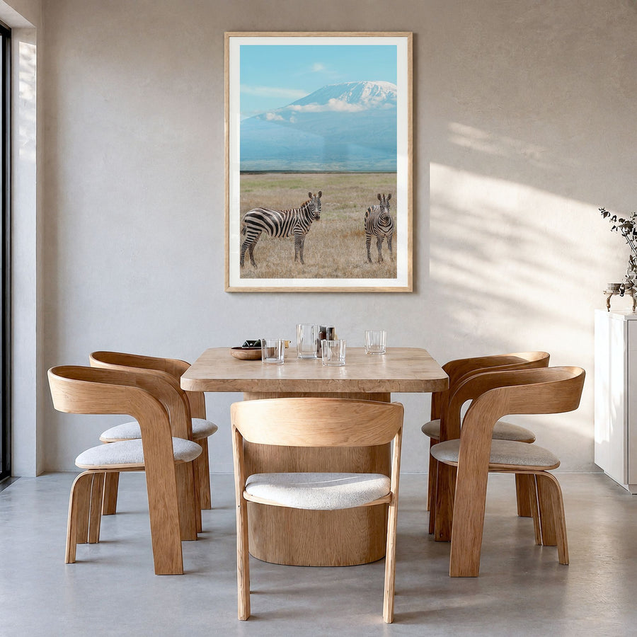 Mount Kilimanjaro Photo No 3 Poster in a natural wood frame, hanging in a dining room, white border
