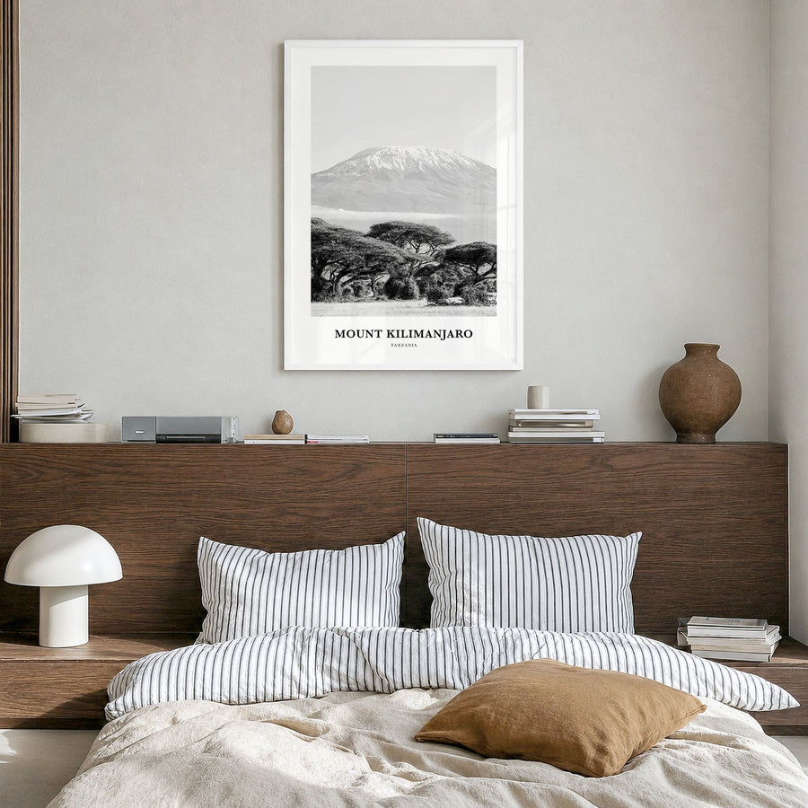 Mount Kilimanjaro Classic Poster in a white wood frame, hanging in a bedroom