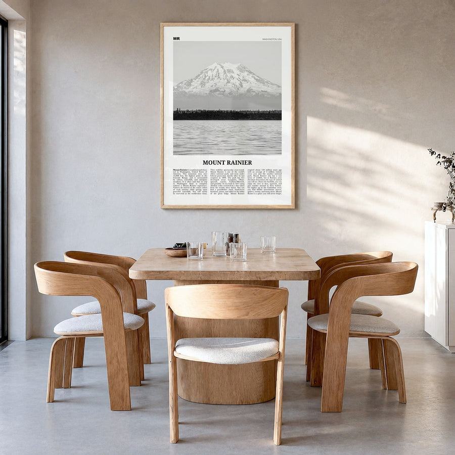 Mount Rainier Newspaper Poster in a natural wood frame, hanging in a dining room
