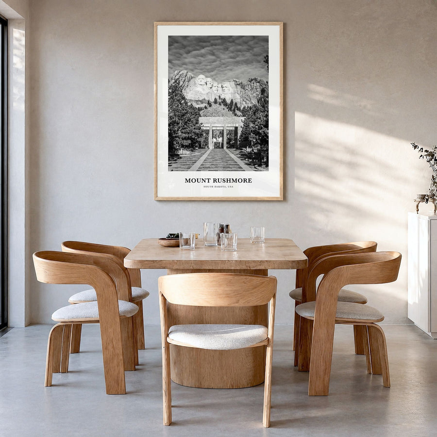 Mount Rushmore Classic Poster in a natural wood frame, hanging in a dining room