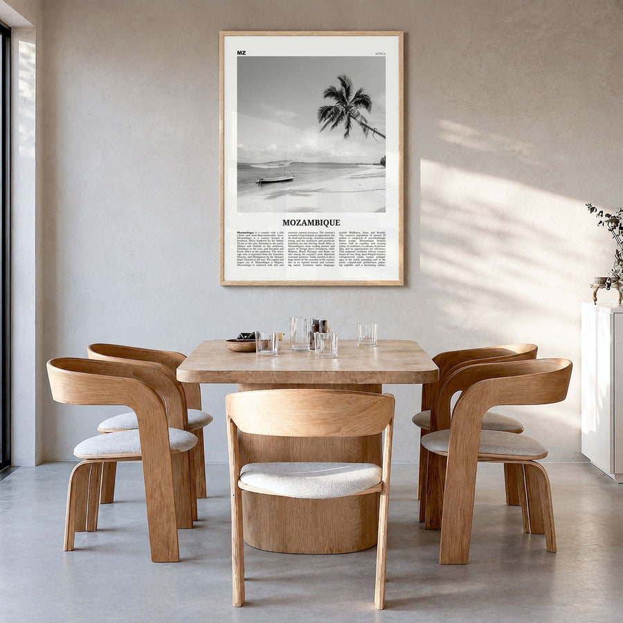 Mozambique Newspaper Poster in a natural wood frame, hanging in a dining room