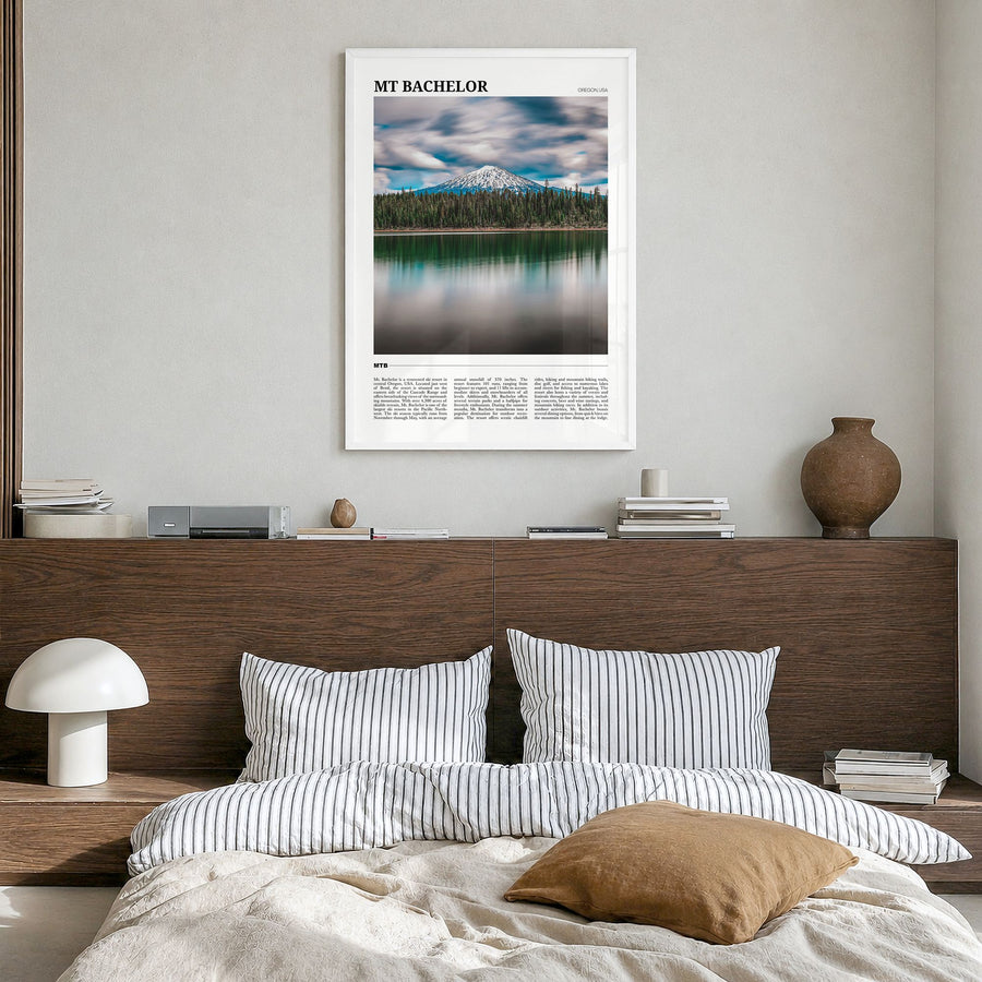 Mt Bachelor Travel Poster in a white wood frame, hanging in a bedroom