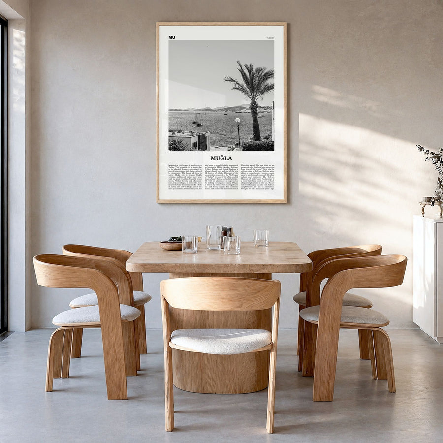 Muğla Newspaper Poster in a natural wood frame, hanging in a dining room