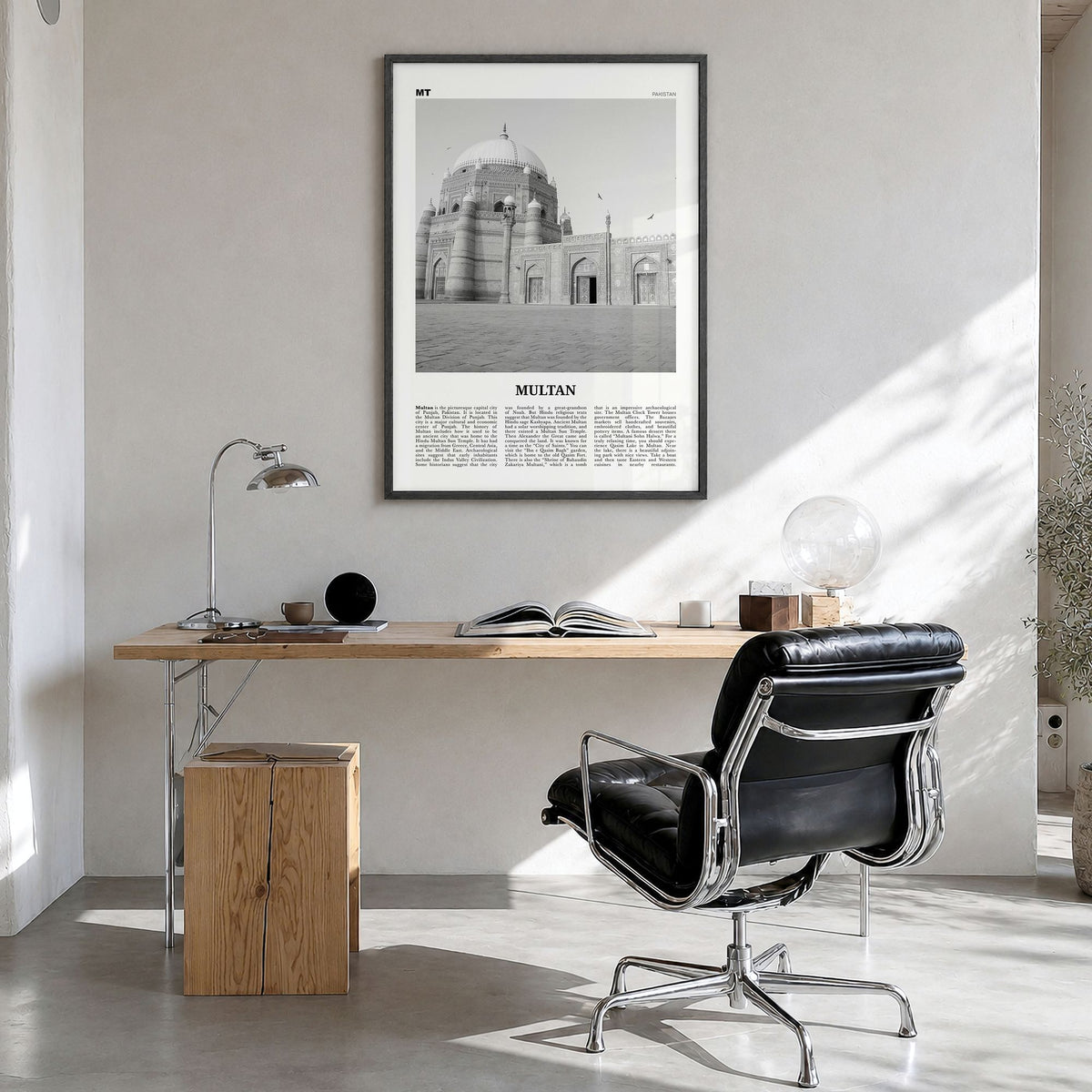 Multan Newspaper Poster in a black wood frame, hanging in a bright home office