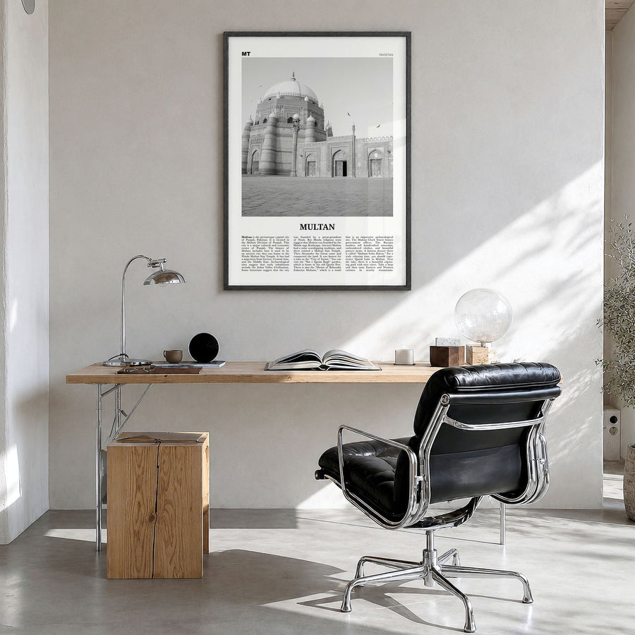 Multan Newspaper Poster in a black wood frame, hanging in a bright home office