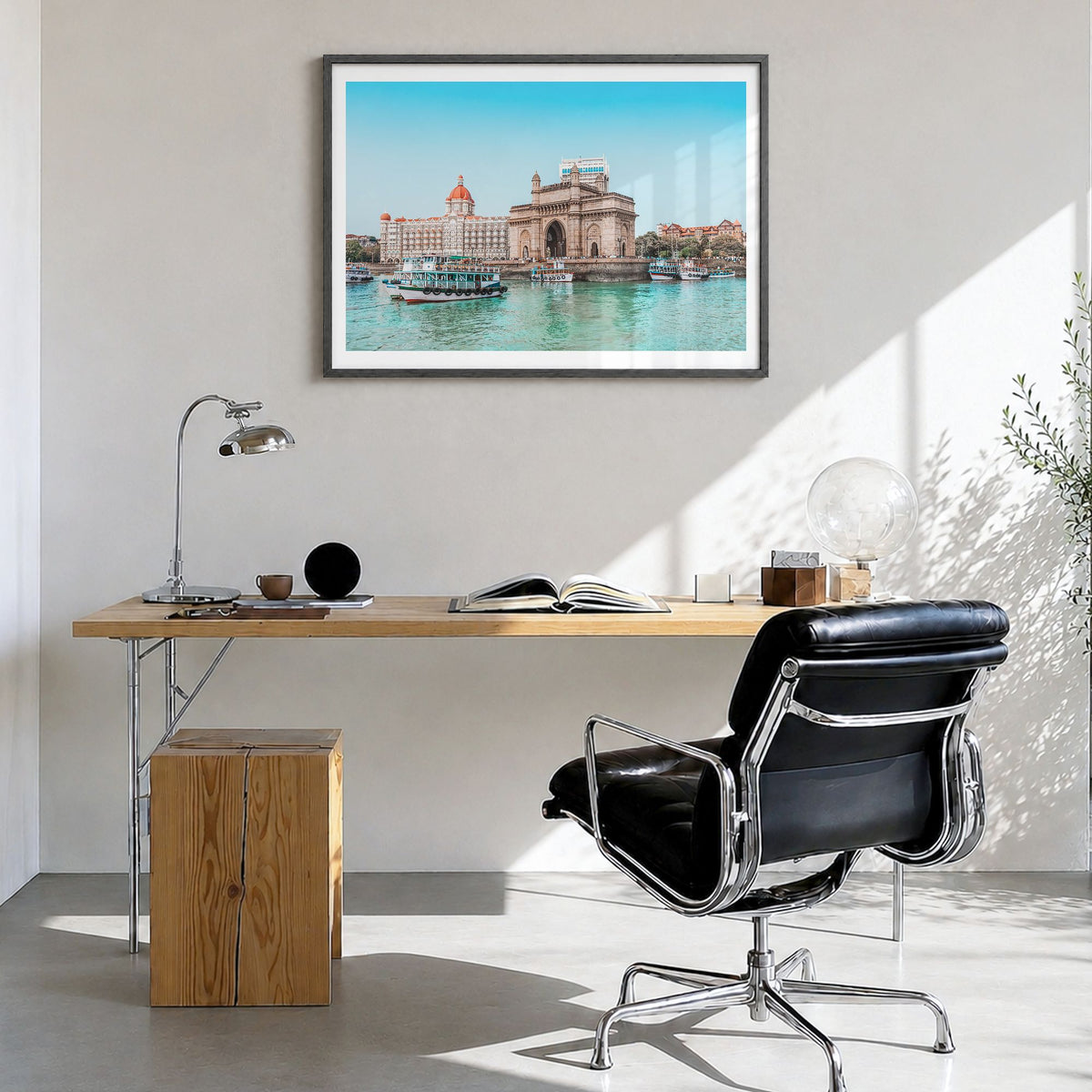 Mumbai Photo Poster in a black wood frame, hanging in a bright home office, white border