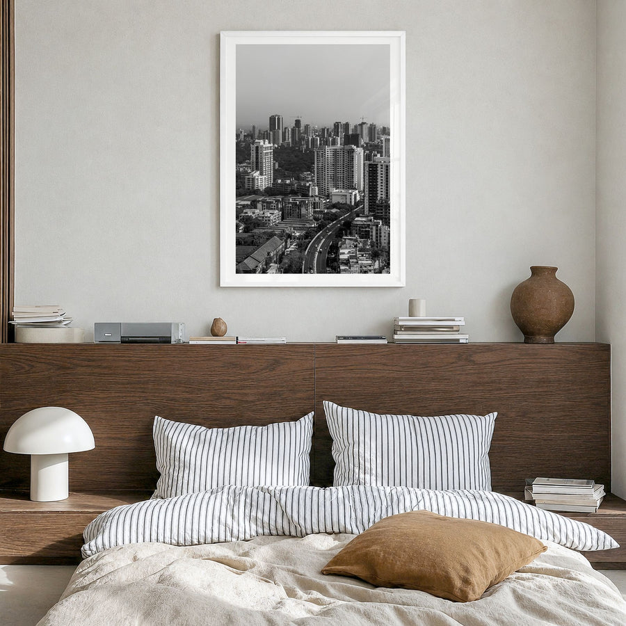 Mumbai Photo Poster in a white wood frame, hanging in a bedroom, white border