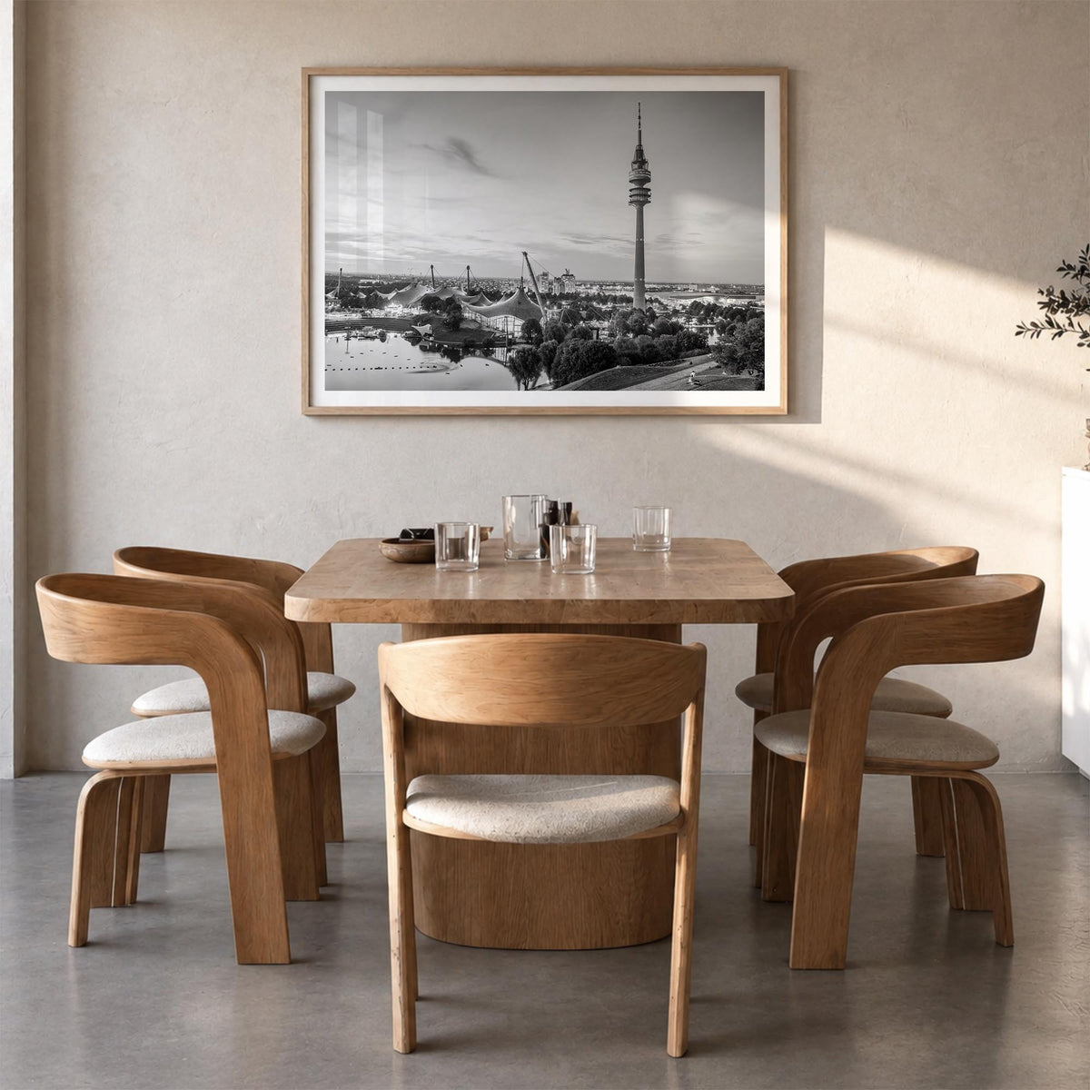 Munich black & white photo poster of Germany – horizontal wall art in natural wood frame with white border, hanging on wall
