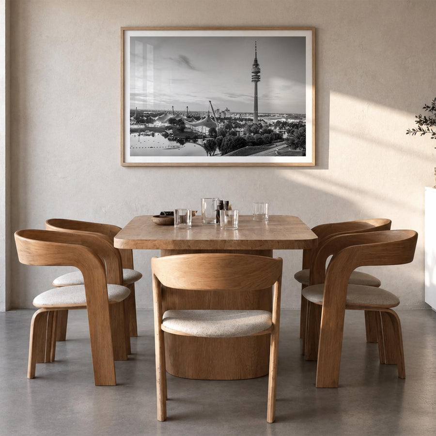 Munich black & white photo poster of Germany – horizontal wall art in natural wood frame with white border, hanging on wall