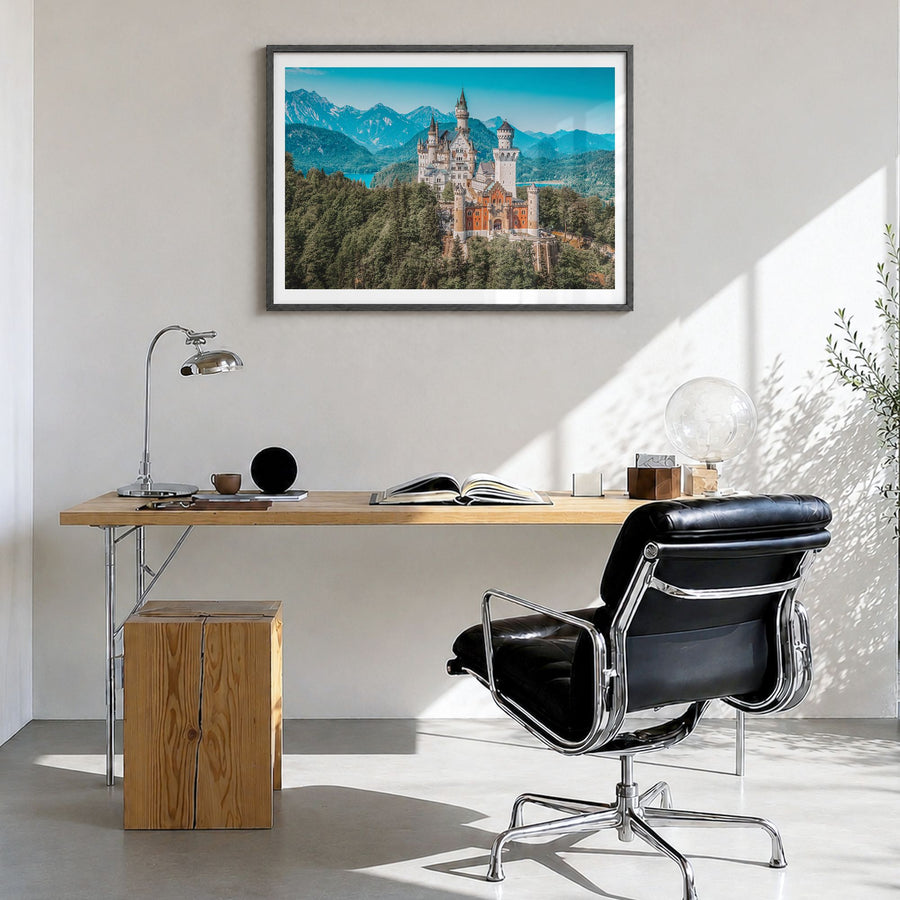 Munich Photo Poster in a black wood frame, hanging in a bright home office, white border