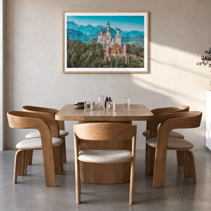 Munich Photo Poster in a natural wood frame, hanging in a dining room, white border
