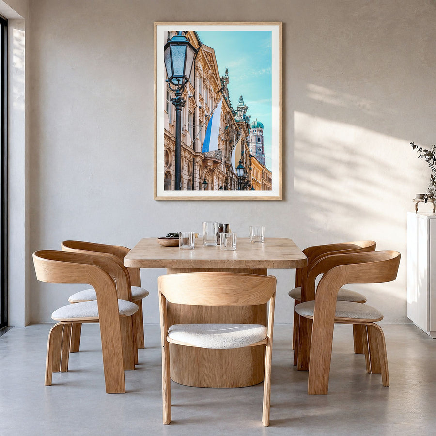 Munich Photo No 3 Poster in a natural wood frame, hanging in a dining room, white border