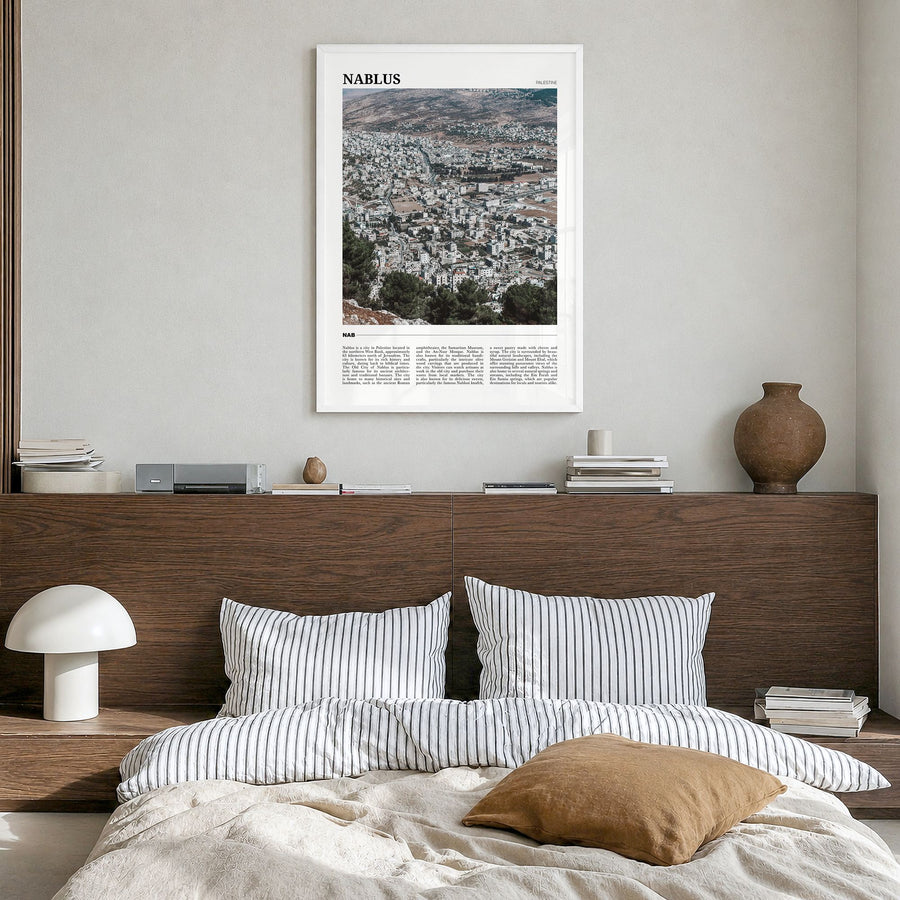 Nablus Travel Poster in a white wood frame, hanging in a bedroom