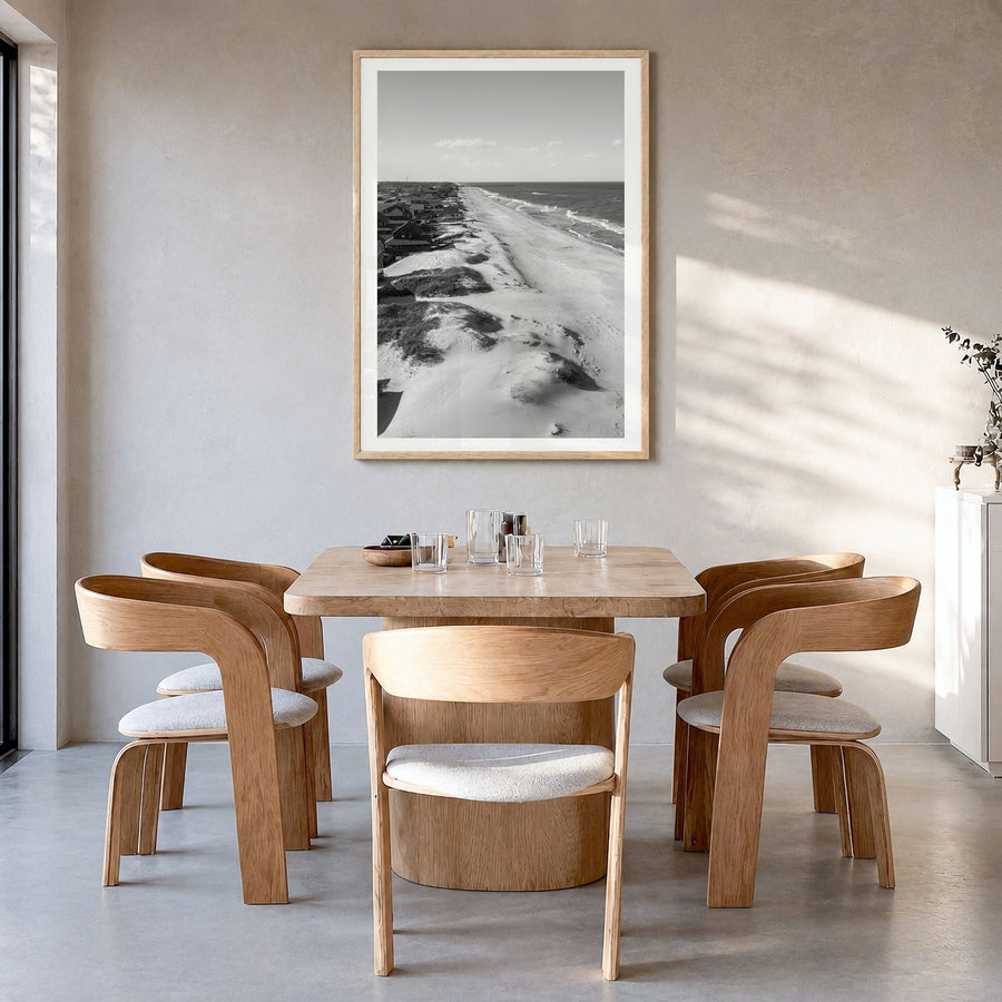 Nags Head Photo Poster in a natural wood frame, hanging in a dining room, white border