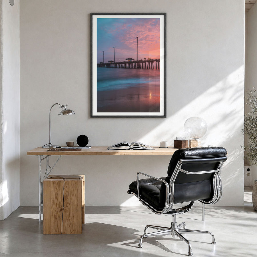 Nags Head Photo Poster in a black wood frame, hanging in a bright home office, white border