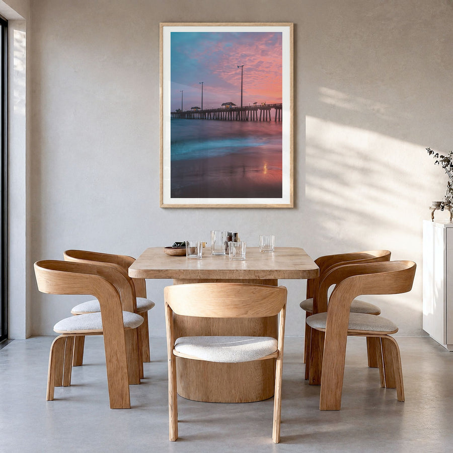 Nags Head Photo Poster in a natural wood frame, hanging in a dining room, white border