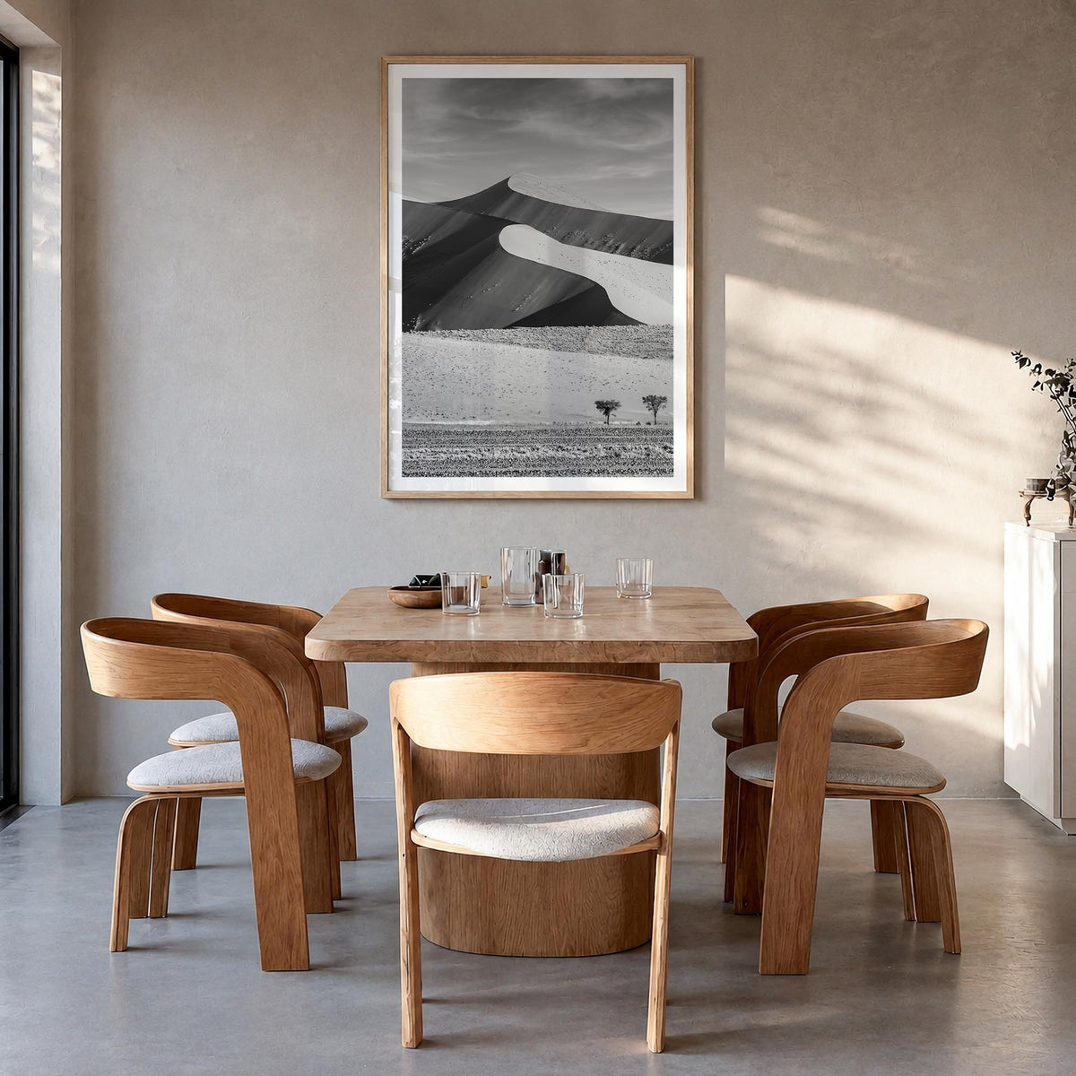 Namibia black & white photo poster of Africa – vertical wall art in natural wood frame with white border, hanging on wall