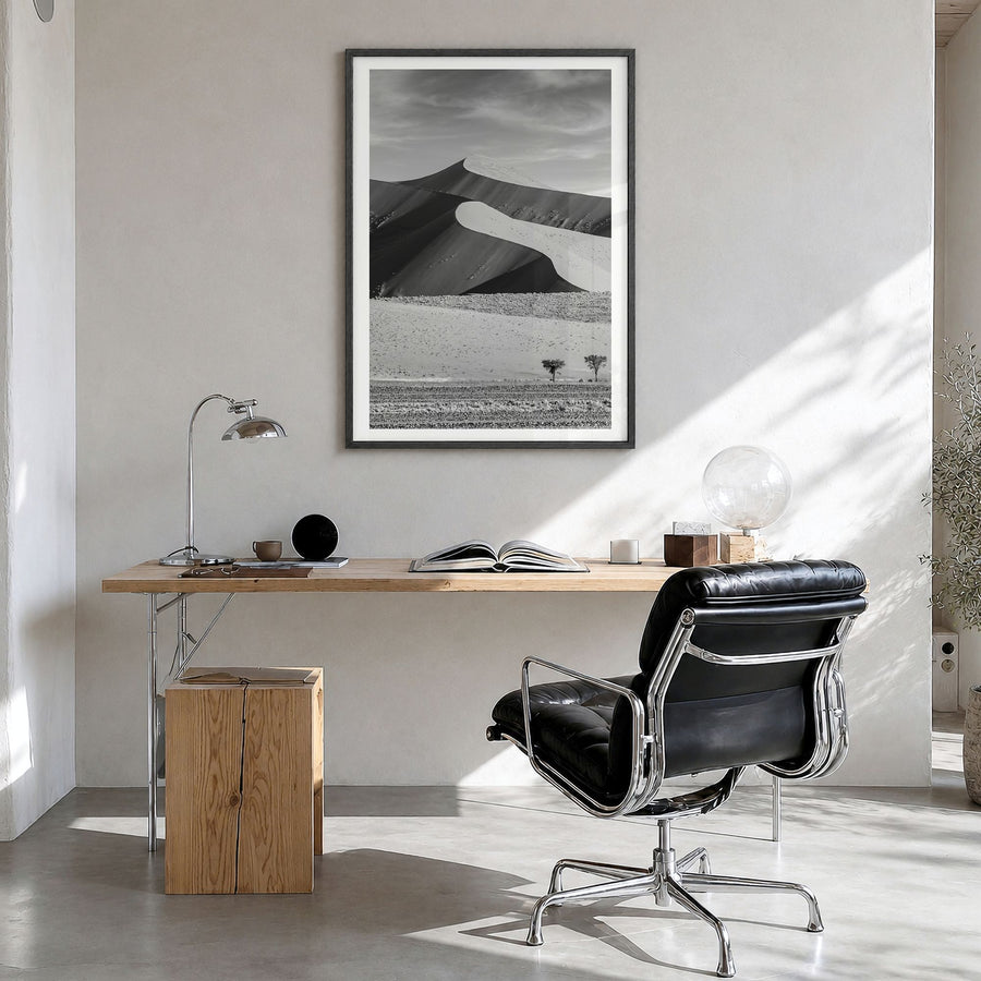Namibia Photo Poster in a black wood frame, hanging in a bright home office, white border