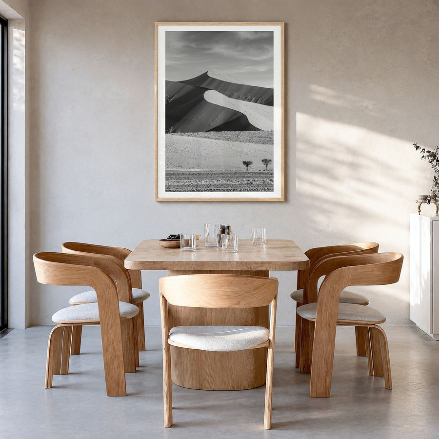 Namibia Photo Poster in a natural wood frame, hanging in a dining room, white border