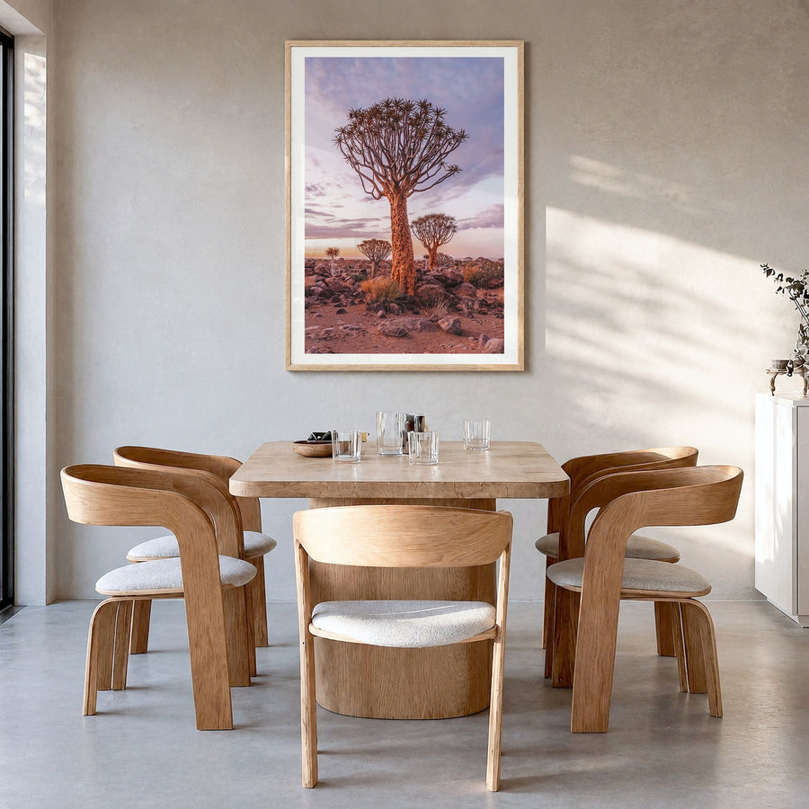 Namibia Photo Poster in a natural wood frame, hanging in a dining room, white border