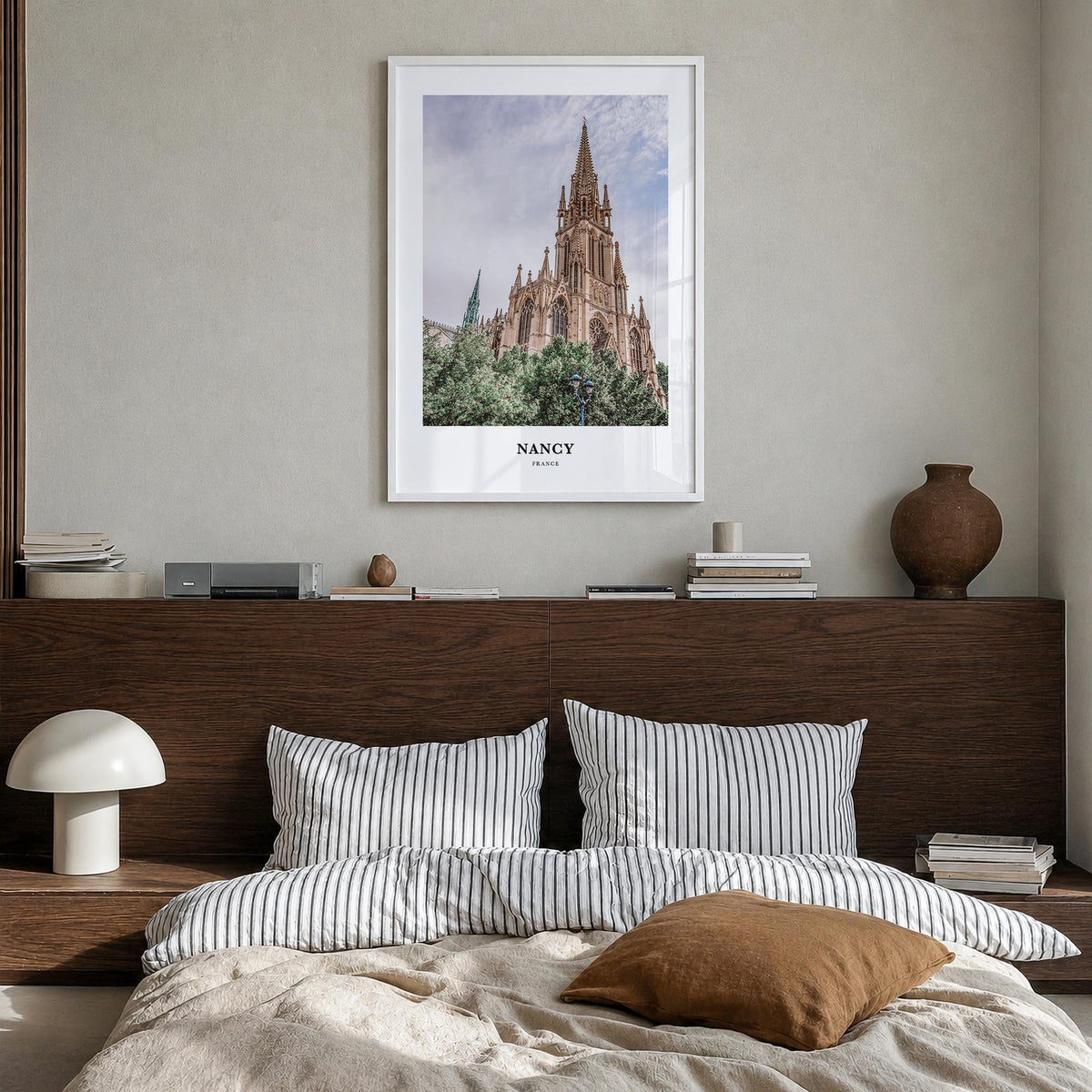Nancy colorful classic poster of France – vertical wall art in white wood frame, hanging on wall