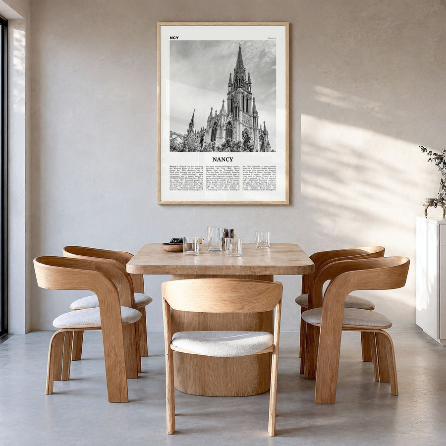 Nancy Newspaper Poster in a natural wood frame, hanging in a dining room