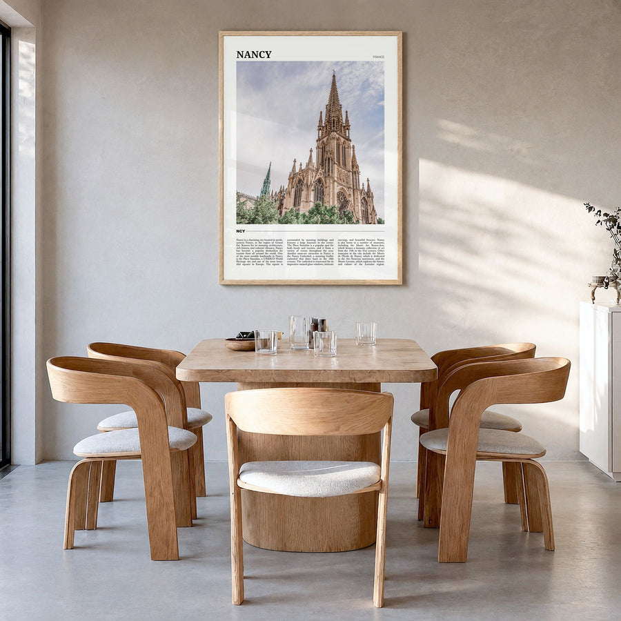 Nancy Travel Poster in a natural wood frame, hanging in a dining room