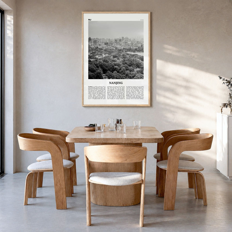 Nanjing Newspaper Poster in a natural wood frame, hanging in a dining room
