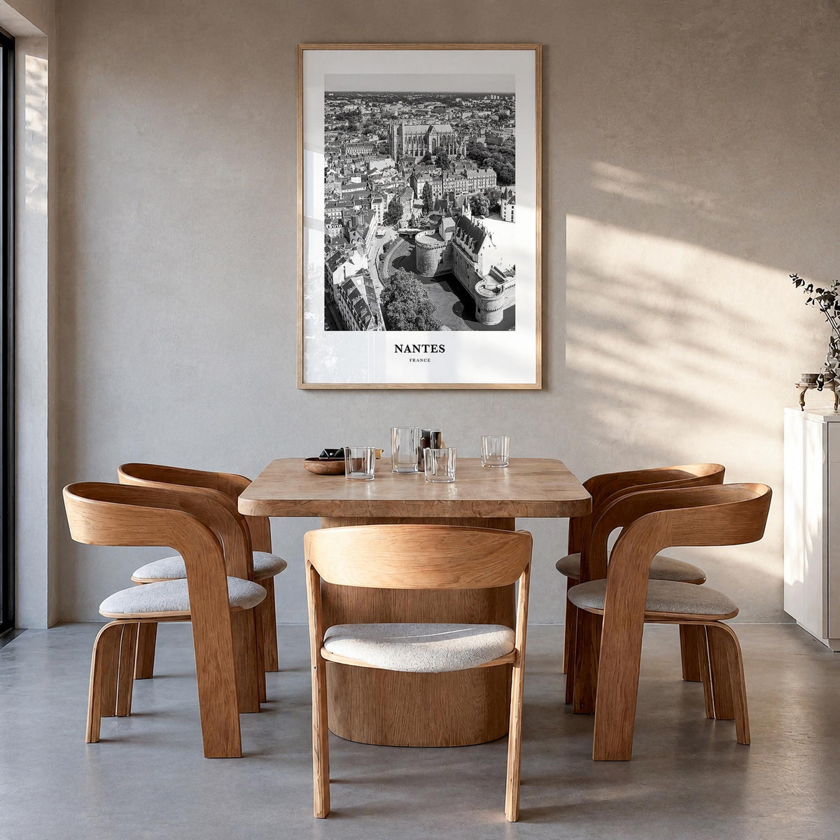 Nantes black & white classic poster of France – vertical wall art in natural wood frame, hanging on wall