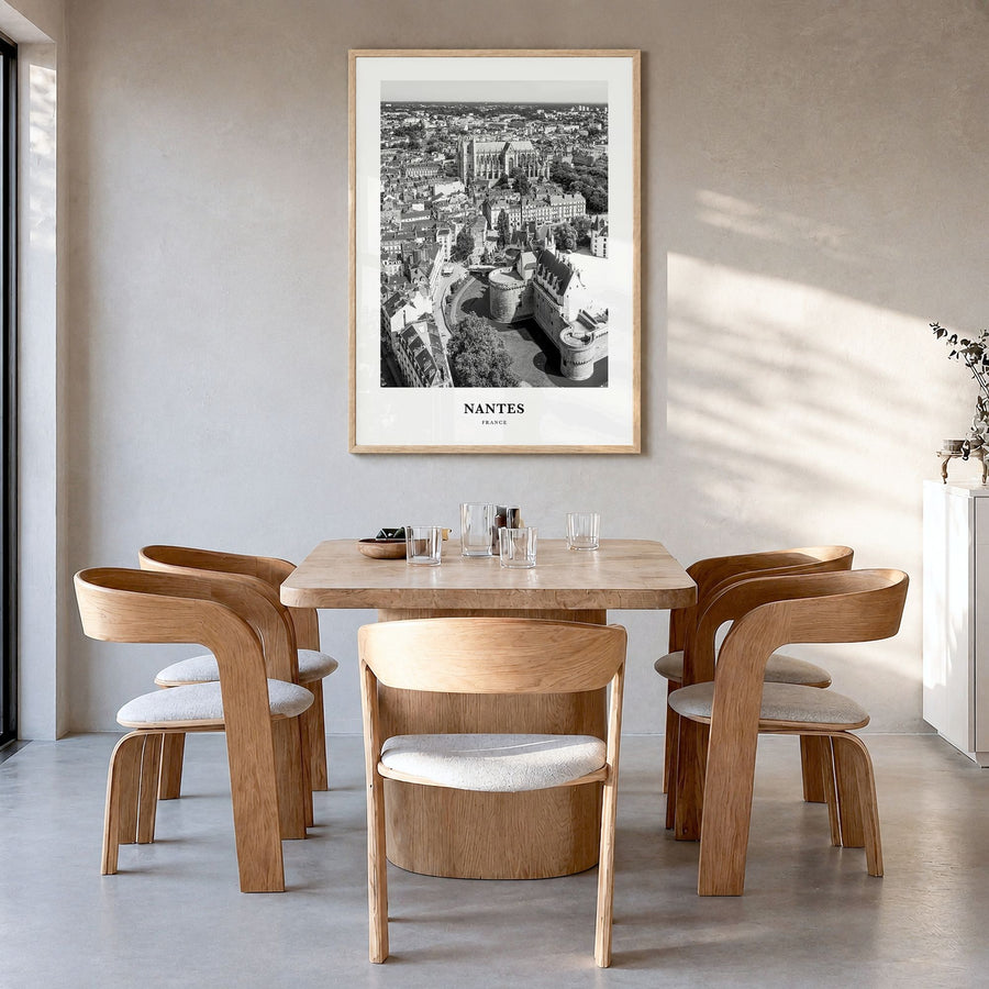 Nantes Classic Poster in a natural wood frame, hanging in a dining room