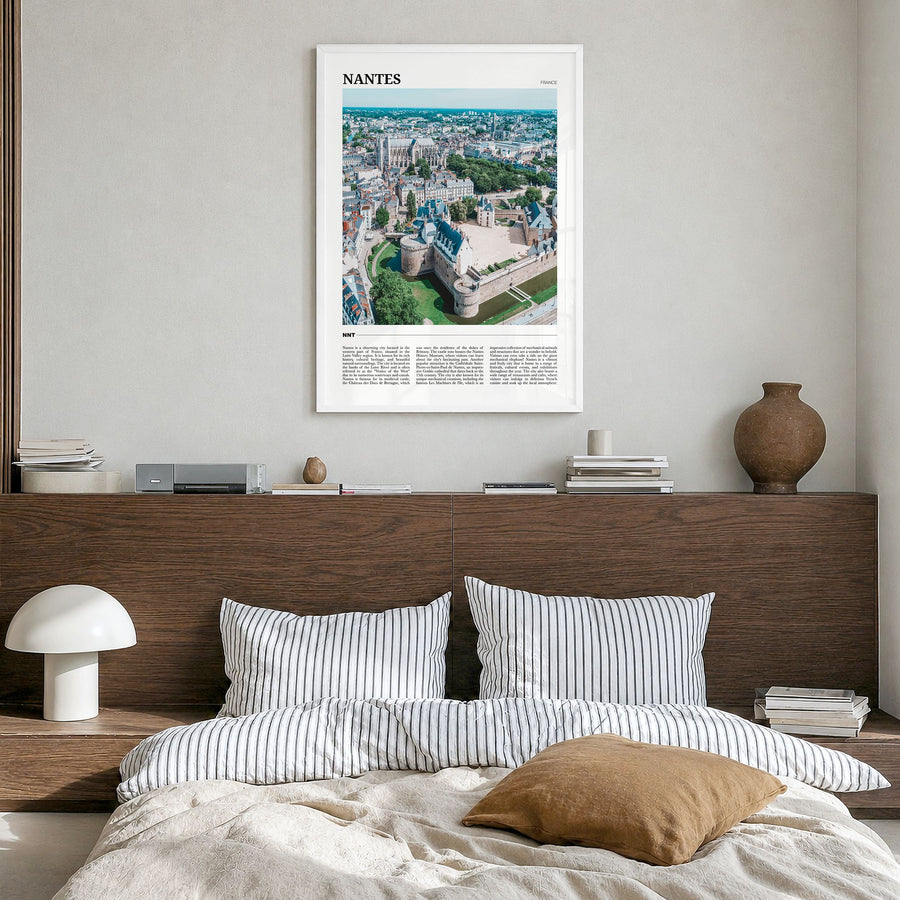 Nantes Travel Poster in a white wood frame, hanging in a bedroom