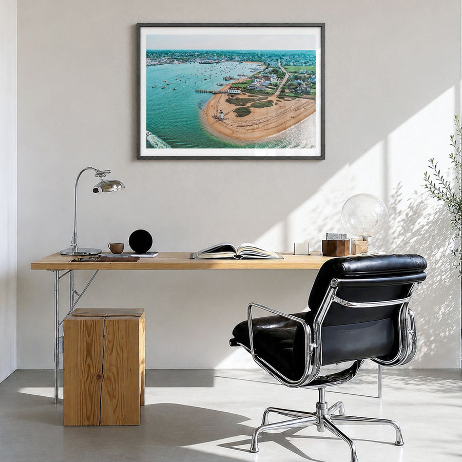 Nantucket Photo Poster in a black wood frame, hanging in a bright home office, white border