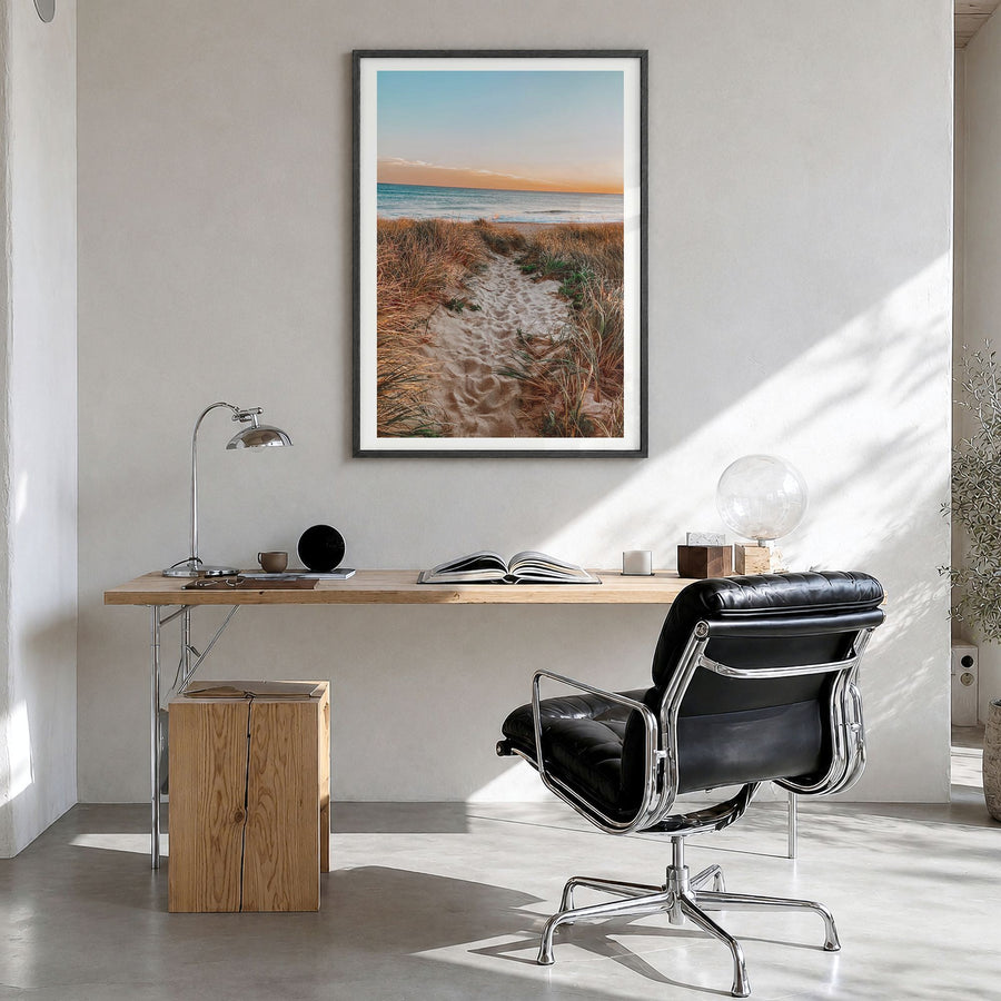 Nantucket Photo Poster in a black wood frame, hanging in a bright home office, white border