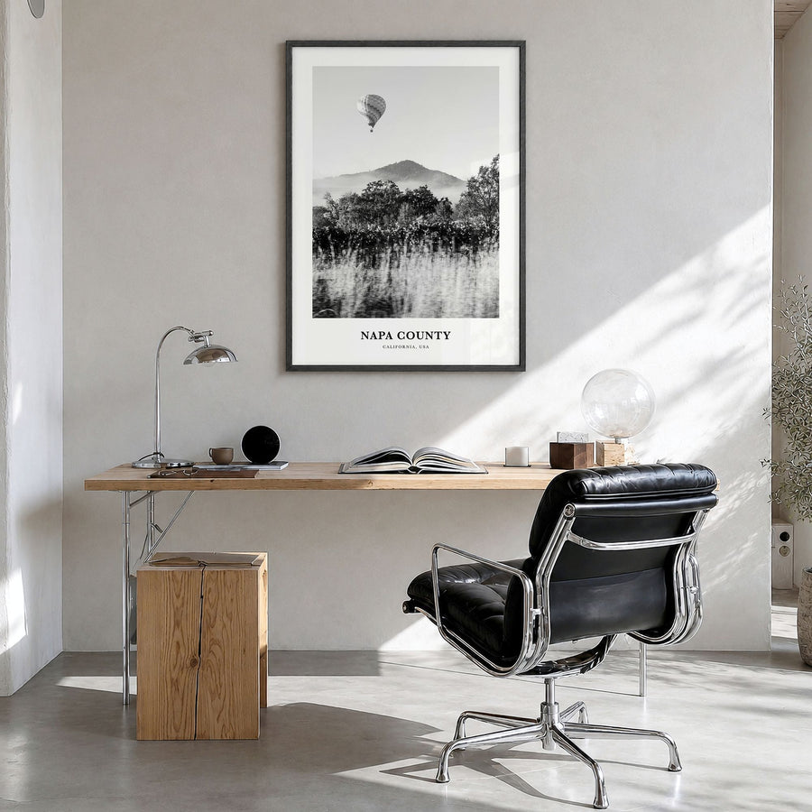 Napa County Classic Poster in a black wood frame, hanging in a bright home office