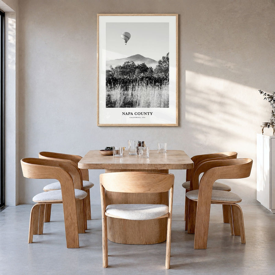 Napa County Classic Poster in a natural wood frame, hanging in a dining room