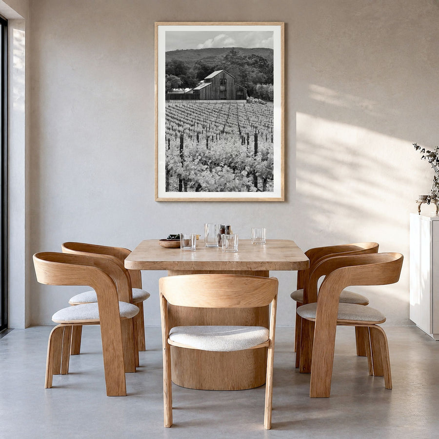 Napa Valley Photo Poster in a natural wood frame, hanging in a dining room, white border