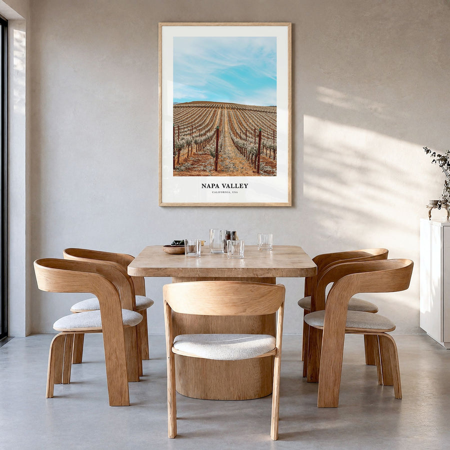 Napa Valley Classic Poster in a natural wood frame, hanging in a dining room