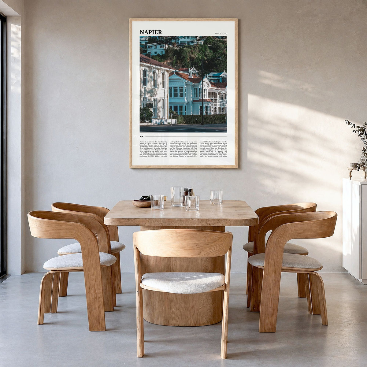 Napier Travel Poster in a natural wood frame, hanging in a dining room