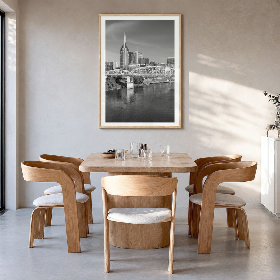 Nashville Photo Poster in a natural wood frame, hanging in a dining room, white border