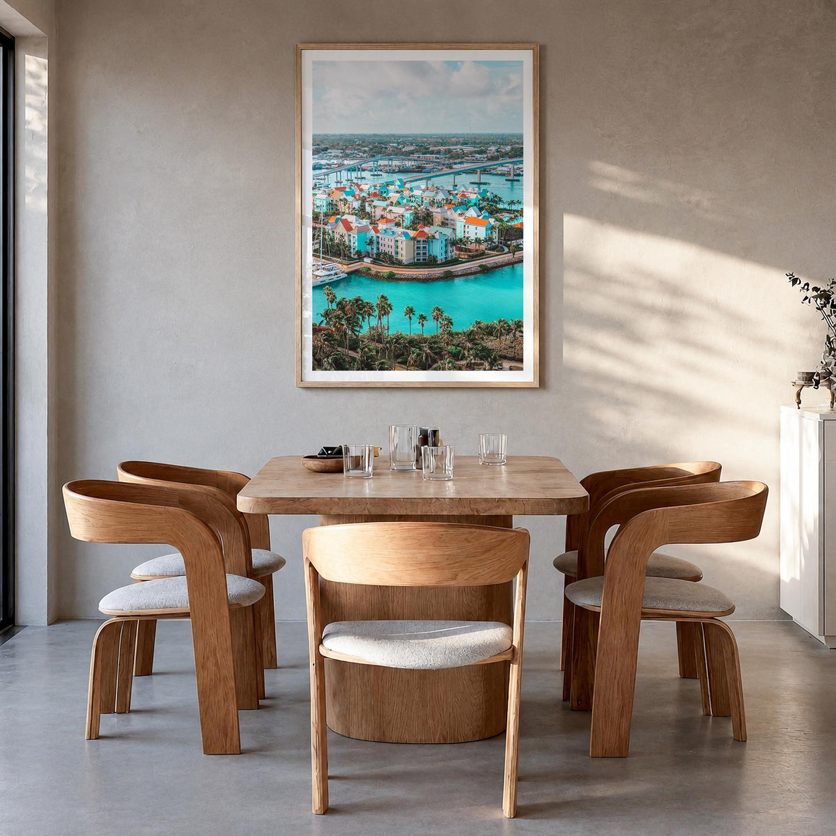 Nassau colorful photo poster of The Bahamas – vertical wall art in natural wood frame with white border, hanging on wall