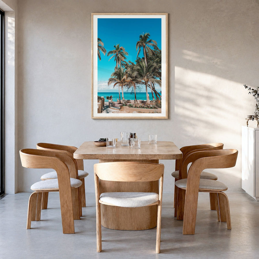 Nayarit Photo Poster in a natural wood frame, hanging in a dining room, white border